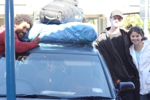 The car piled high and three of its passengers...